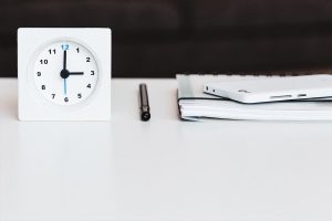 Buyers advocates save you time - stop watch on desk.